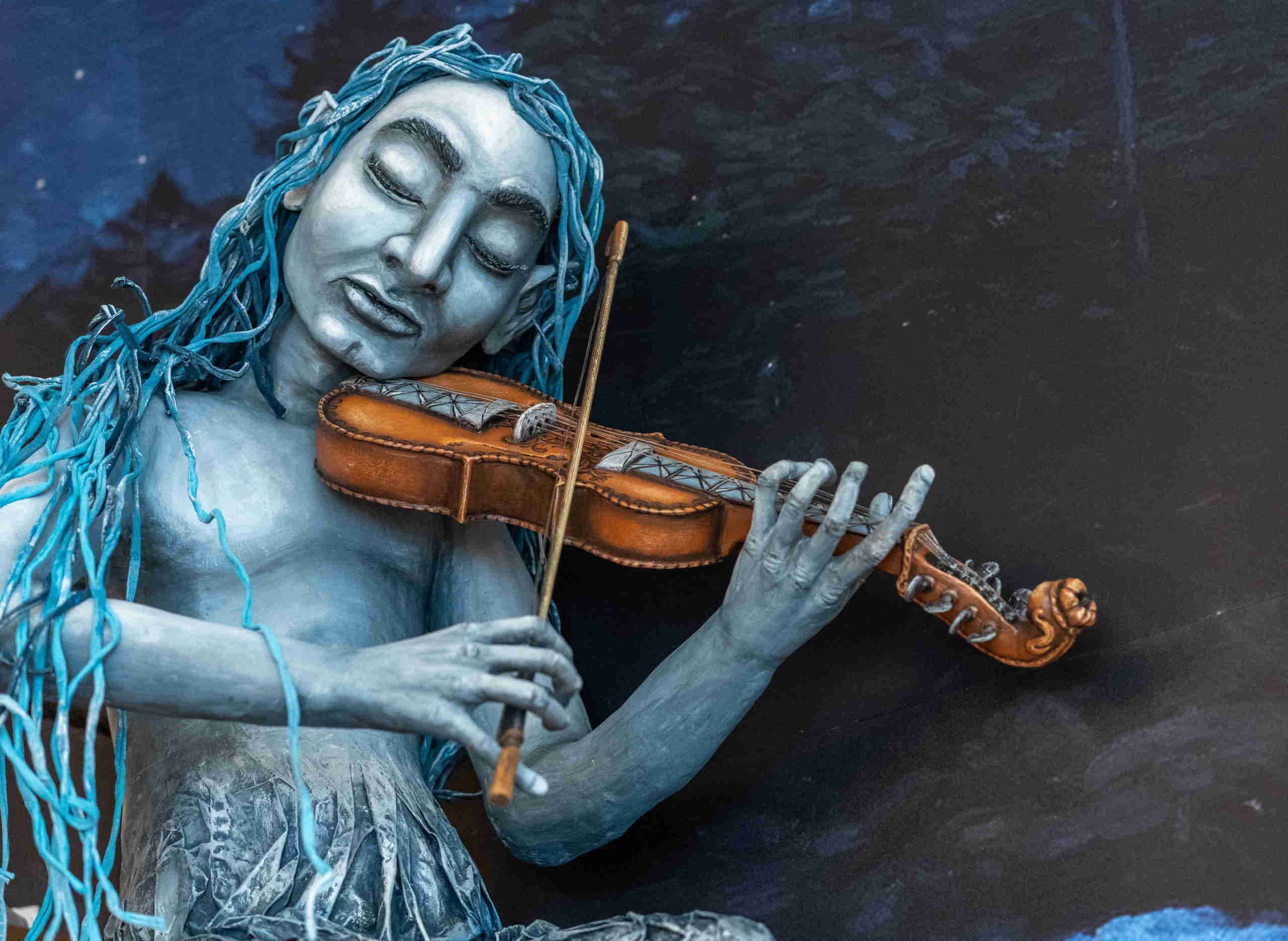 Fossegrimen playing his fiddle